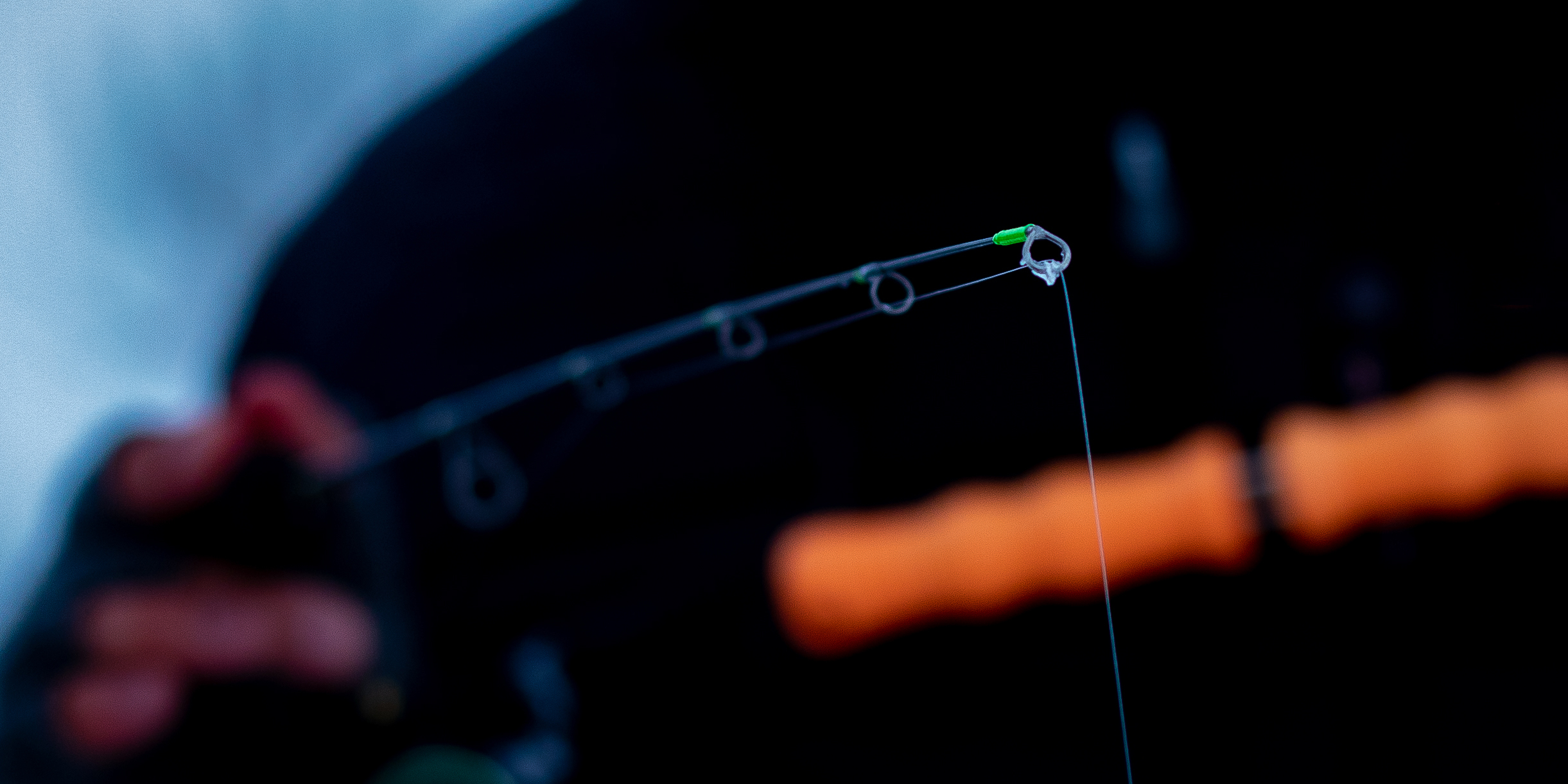 Man Holding the CRYO Noodle Rod detecting a bite